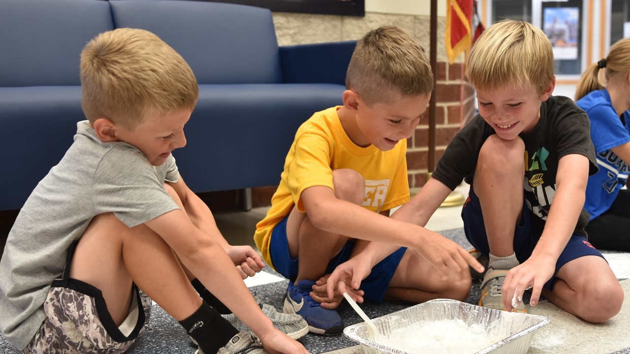 second graders experimenting with oobleck