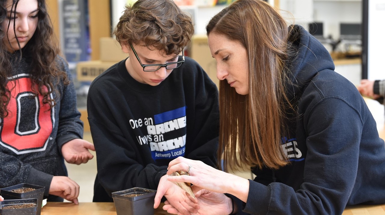 6th graders planting seeds